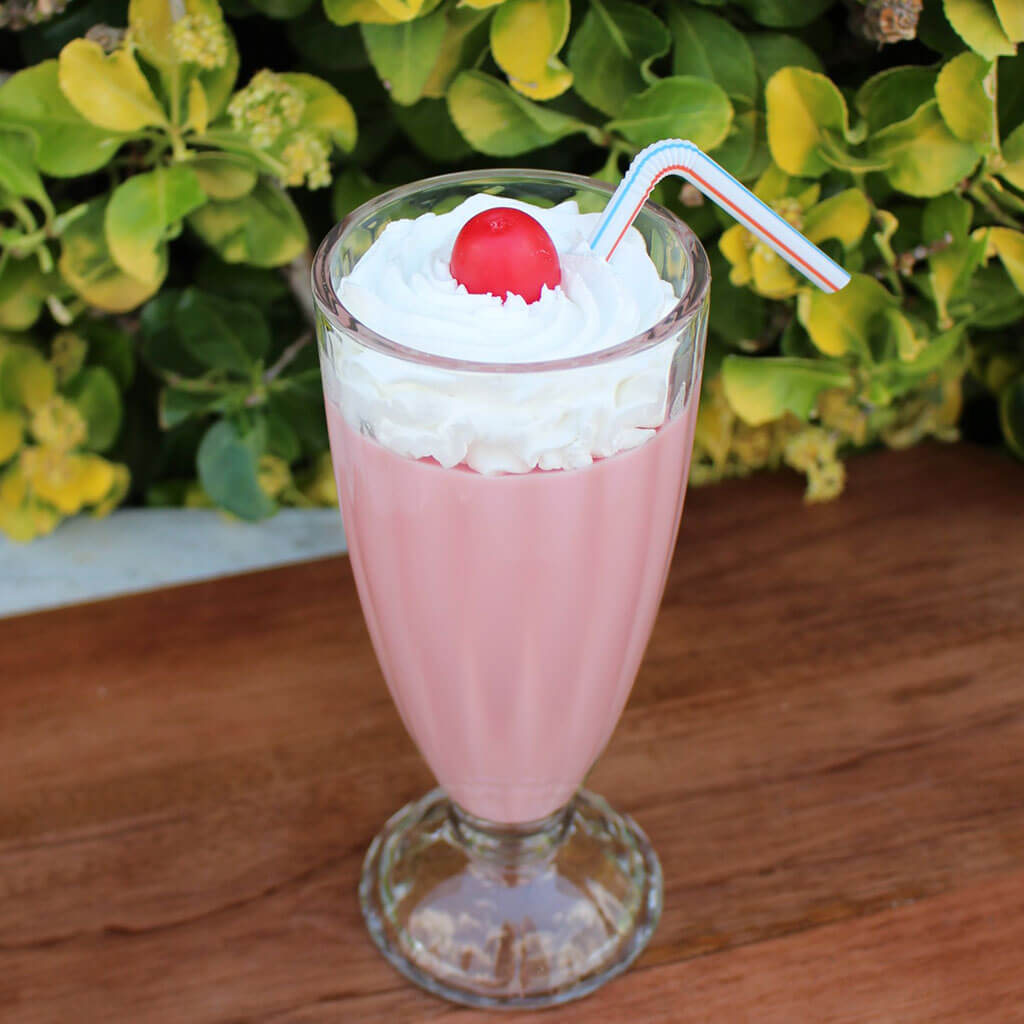 Strawberry Milkshake Topped With A Cherry