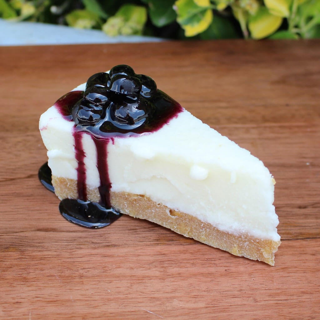 Slice Of Cheesecake Topped With Blueberries